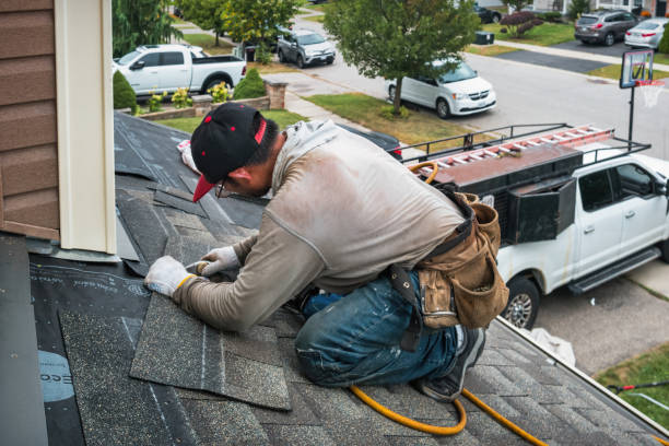Professional Roofing technician working in Grandview, IA